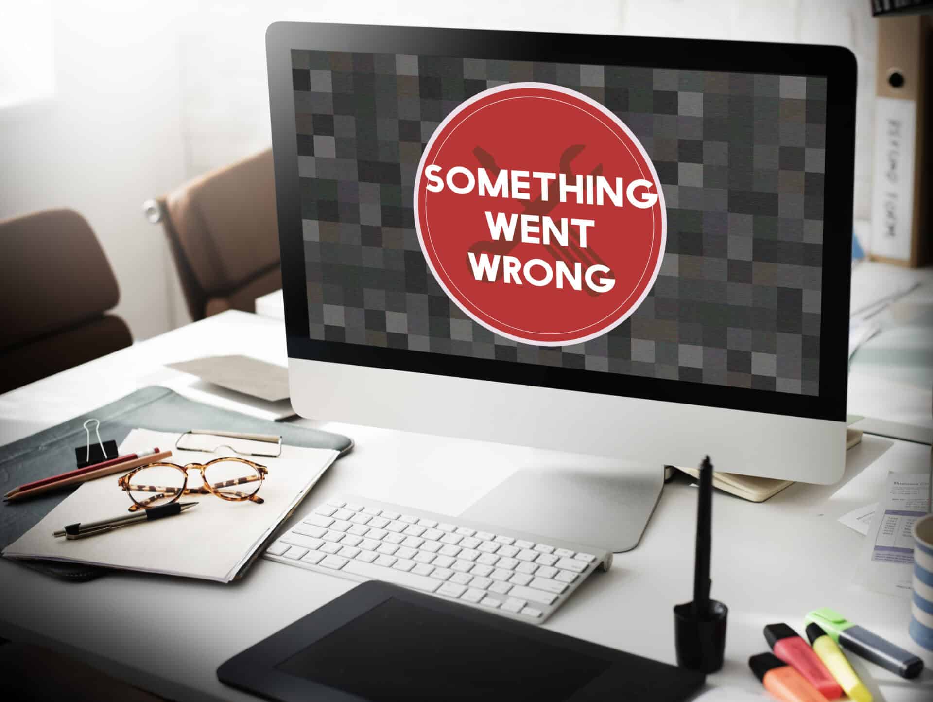 Computer screen error message on office desk